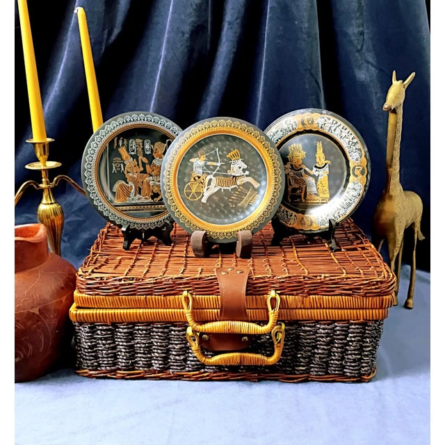This exceptional vintage 3-piece collection of authentic hand-etched Egyptian mixed metal wall plates masterfully captures...