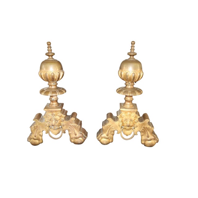 This exquisite pair of antique chenets/ andirons are made in France in the late 19th century. Created in a lustrous doré...