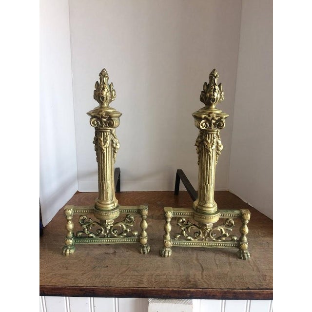 Item: Antique Andirons in Brass, Neoclassical style. Age & Condition: Circa 1900. Good, some patina. Dimensions: 8.5″ wide...