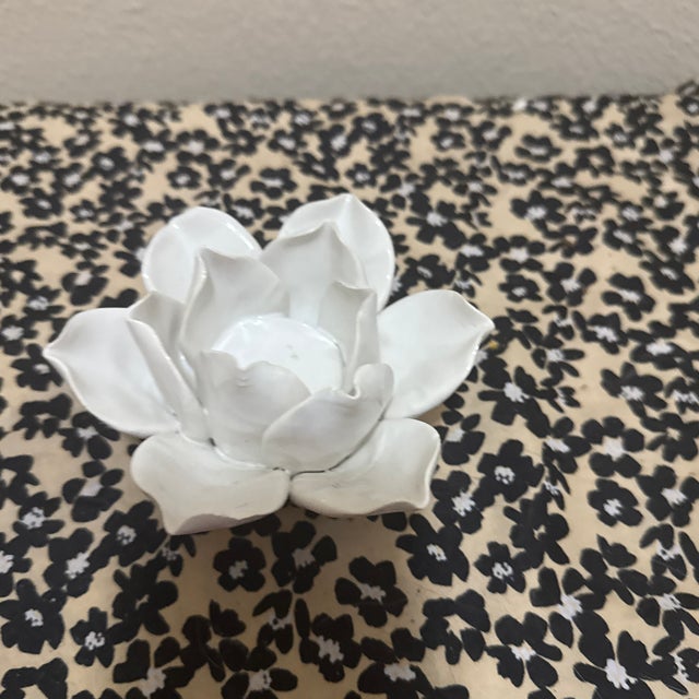 This elegant piece is a White Ceramic Lotus Flower Tealight Candle Holder. Hand-crafted with high-quality glazed ceramic,...