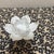 This elegant piece is a White Ceramic Lotus Flower Tealight Candle Holder. Hand-crafted with high-quality glazed ceramic,...