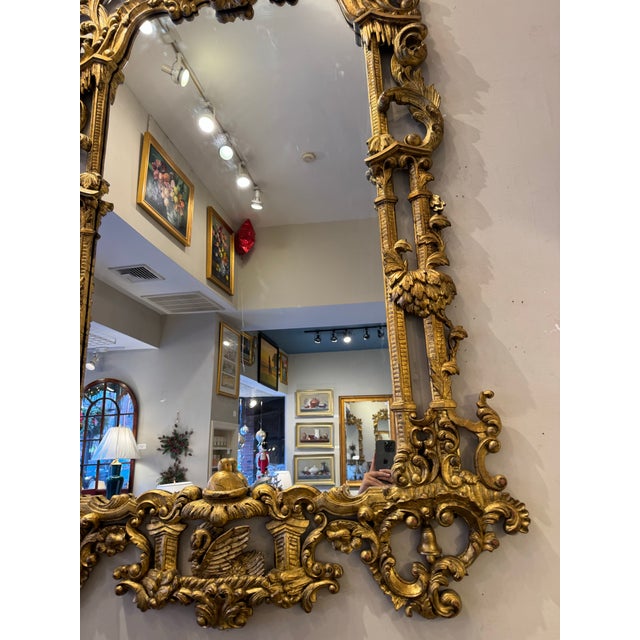 This is an Antique Monumental Chippendale Style Mirror. It is carved wood with gilt. It is stunning and has fabulous...