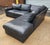 A generously scaled two-piece leather sectional from Century Furniture, designed with plush seating, and the refined...