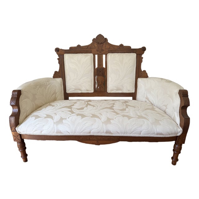Antique Victorian Eastlake Walnut Settee/Loveseat - Reupholstered For Sale