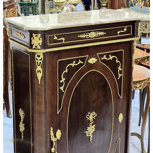 In love with the gold details. Magnificent french Louis XV style copper comode. Stunning French commode. Has a beautiful...