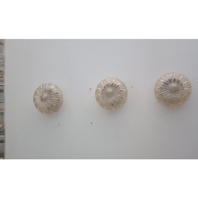 Magnificent set of three Bubble wall sconces by Helena Tynell for Glashütte Limburg. Germany, 1970s. White lacquered metal...