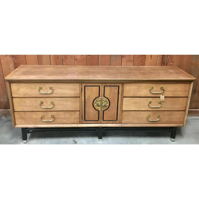 Vintage Asian Style credenza in natural wood, black trim and base with brass hardware. Great as a buffet or credenza....
