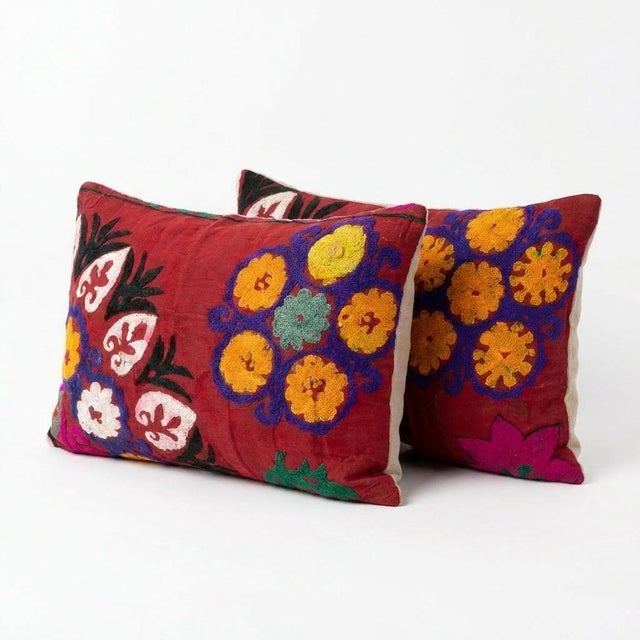 This beautiful 17'' x 28'' & 20'' x 28'' hand-embroidered Suzani pillow cover set was made from authentic Uzbek cotton...