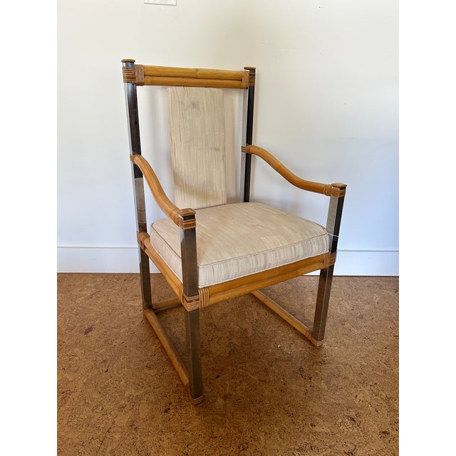 Vintage 1970s bamboo and chrome arm lounge chair, upholstered. Can be used as a captains chair or accent chair. Also...