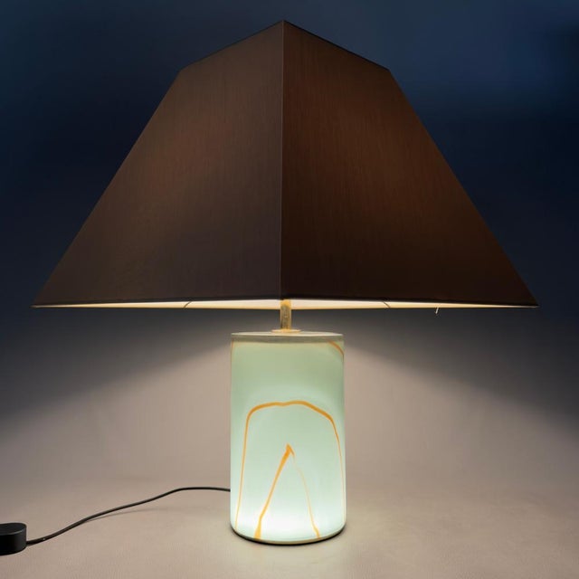A lighting fixture of exceptional rarity and refined value. This exquisite table lamp, model "joe" by g luce, is an...