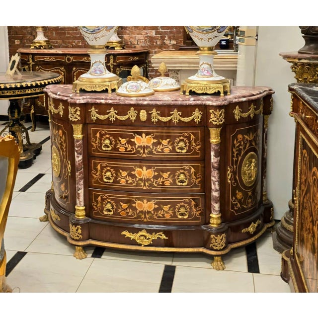 Make an unforgettable statement with this Monumental French Empire Bombe Commode, an extraordinary masterpiece that blends...