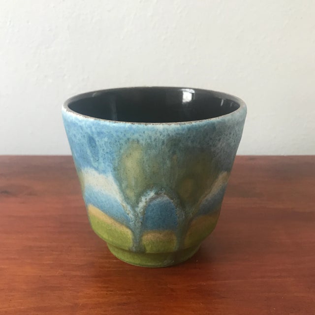 Incredible Mid Century Modern pottery vase expertly created in Germany. Gorgeous glazed turquoise, green, and blue body....