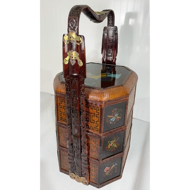 This striking antique Chinese wedding basket is a rare blend of artistry and tradition. Featuring a carved wood handle...