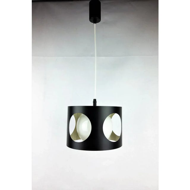 Large 1960 vintage suspension. Black lacquered metal tube with 4 holes. Opaline glass globe. Black lacquered metal wire...