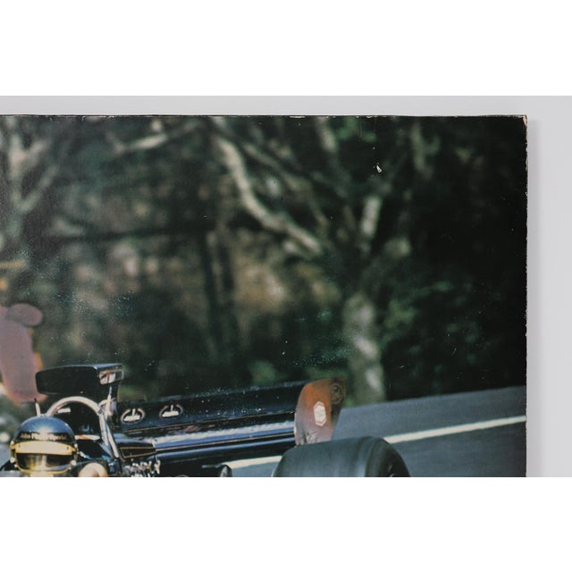 Black Champion Advertising Poster of Ronnie Peterson in John Player Special Lotus, 1973 For Sale - Image 8 of 11
