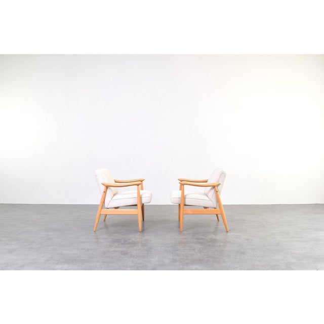 This set of two armchairs model GFM-87 was designed by Juliusz Kędziorek and manufactured in Poland in the 1960s, is one...