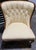This is a matching pair of elegant antique style slipper chairs. These armless accent chairs are upholstered in a light...