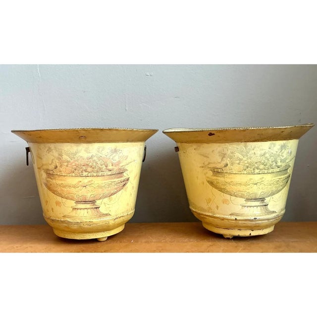 This pair of vintage French toile metal cache pots has the softly faded charm of a well-loved European garden accessory....