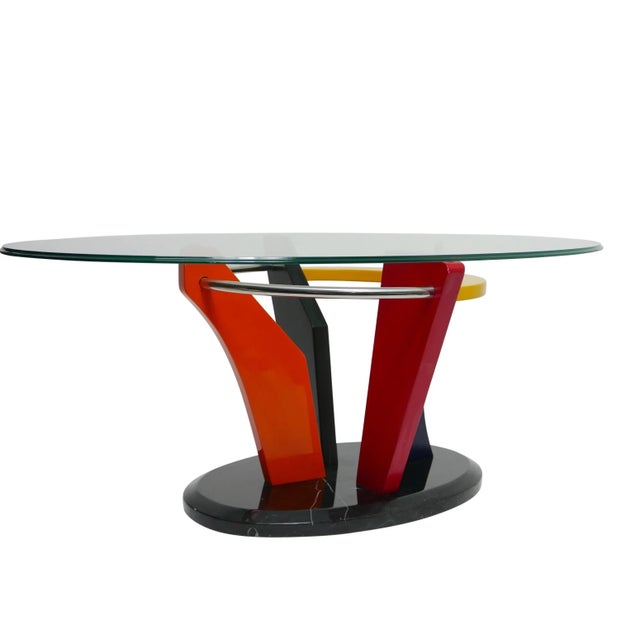 Vibrant and bold Memphis lacquered and polished marble base with oval glass top coffee table, Completely intact and...