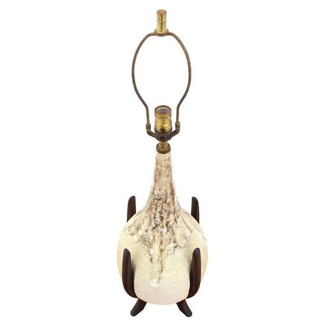 Dripping vase pattern ceramic table lamp on oiled walnut base. Perfect for a mid century style home.