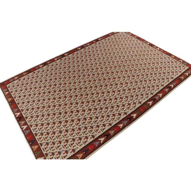 Handwoven in fine wool, a 10x14 antique kilim rug from believed to be of rare Macedonian origin, circa 1920-1930....