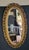 French Early 1900s French Style Hand Carved Gilded Oval Beveled Wall Mirror For Sale - Image 3 of 12
