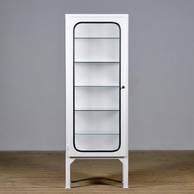 Vintage medical cabinet from the 1970s, made in Hungary. This characterful cabinet is made of iron and glass, with the...