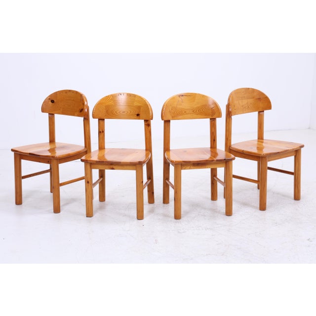 Set of four wooden dining chairs in the style of the 1970s. Robust construction meets striking Scandinavian design. A...