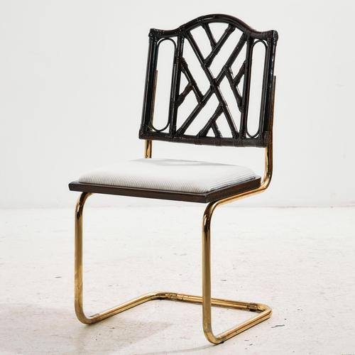 Tubular chair with bamboo backrest and textile upholstery from the 1970s. The chair’s cantilevered base ensures...