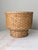 Vintage split reed bamboo basket with a sculptural design and 9" solid wood base.