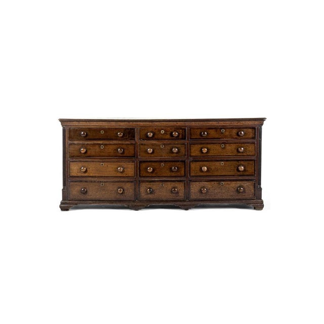 An impressive bank of oak drawers that would have been the base for a substantial Georgian dresser. The thick single plank...