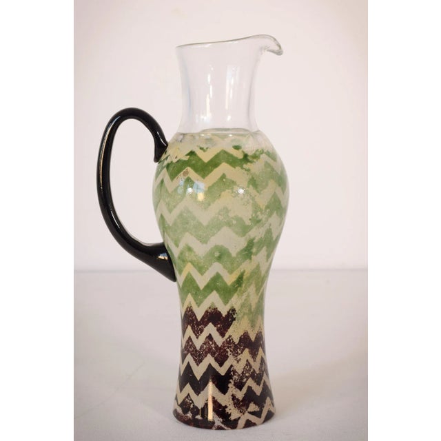 This art glass jug is a piece by kosta boda, highly fashionable swedish glassware makers founded in 1742. A wonderfully...