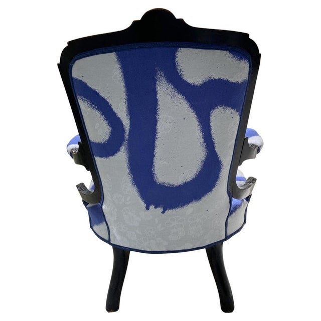 Armchair hand carved and ebonised is made in walnut. The frame with details refined inlay patterns in nut wood and boxwood...