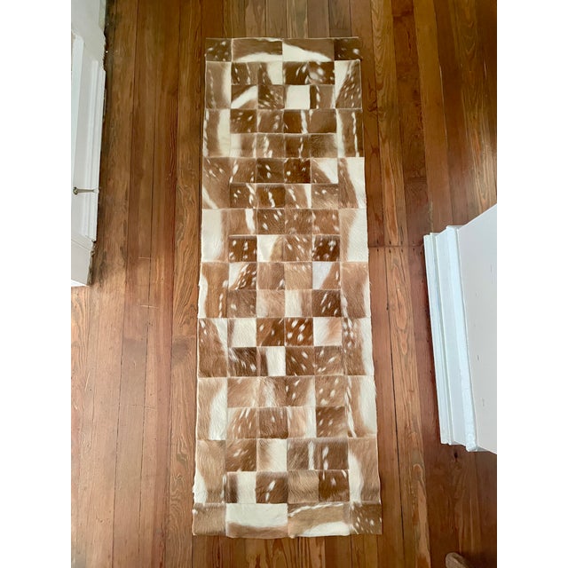 This decorative patchwork of axis deer hide remnants can be used for a multitude of decorative purposes, including as a...
