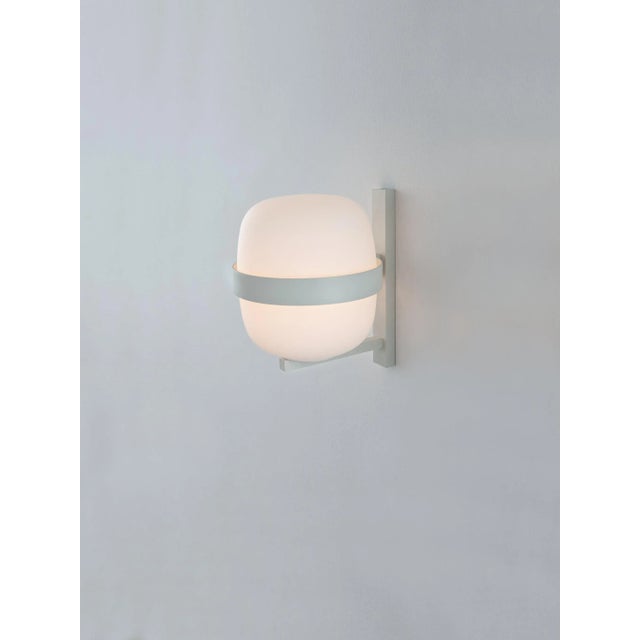 White wally wall lamp by miguel milá dimensions: d 18.4 x w 10 x h 24 cm materials: metal, glass. Also available in black....