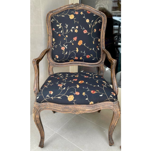 This is an absolutely delightful pair of French Louis XV armchairs covered in a sumptuous silk embroidered fabric by...