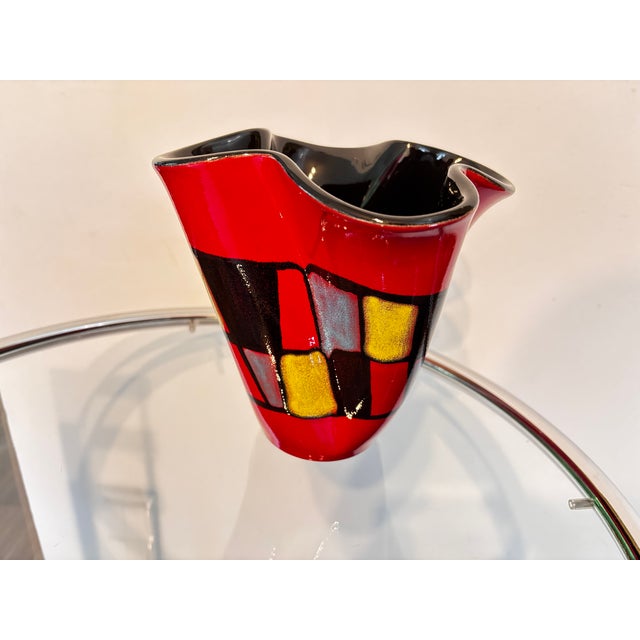 Red checkered corolla vase signed Elchinger, ceramist in Alsace, France, in perfect condition This piece has an...