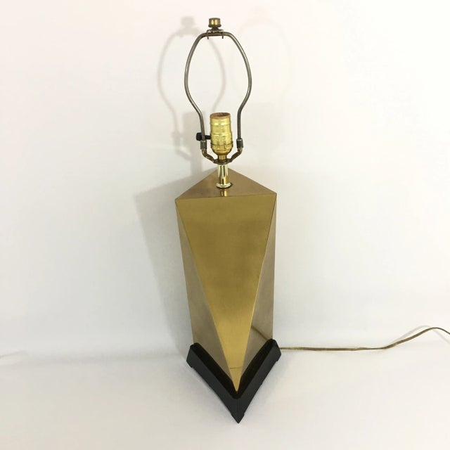 Beautiful single vintage brass triangular faceted lamp with a black triangular wooden base. Mirrored brass triangular...