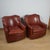A pair of art deco moustache backed club chairs with chestnut leather upholstery. Dimensions: h 78cm w 71cm d 80cm seat h...