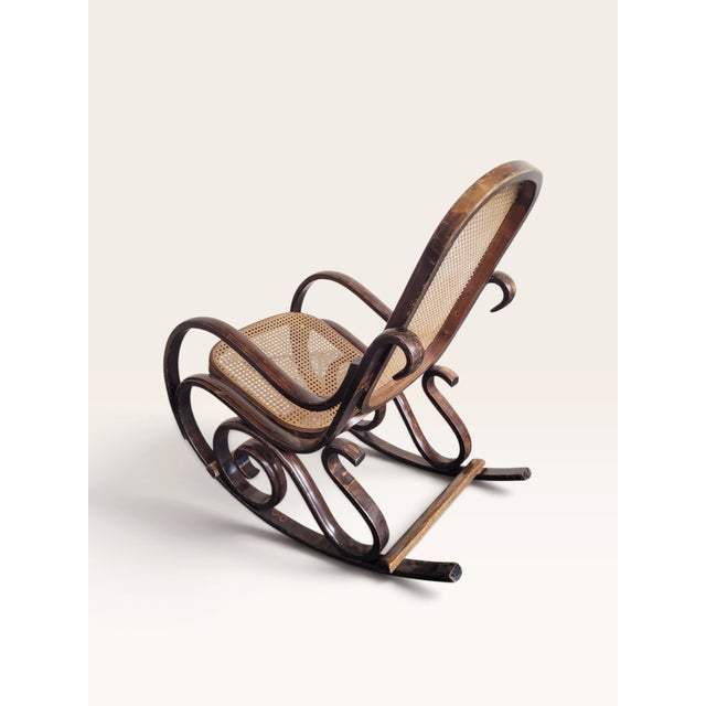 A highly decorative late 19th-century bentwood rocking chair, dating to approximately circa 1890, crafted from beautifully...