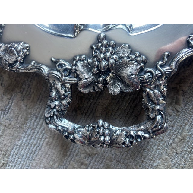A beautiful heavily-chased two handled silver-plate wine serving tray made by Barbour International Silver Company,...
