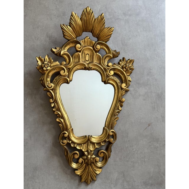 Magnificent antique mirror in the shape of cornucopias. from an unknown French manufacturer in the 1950s. In original...