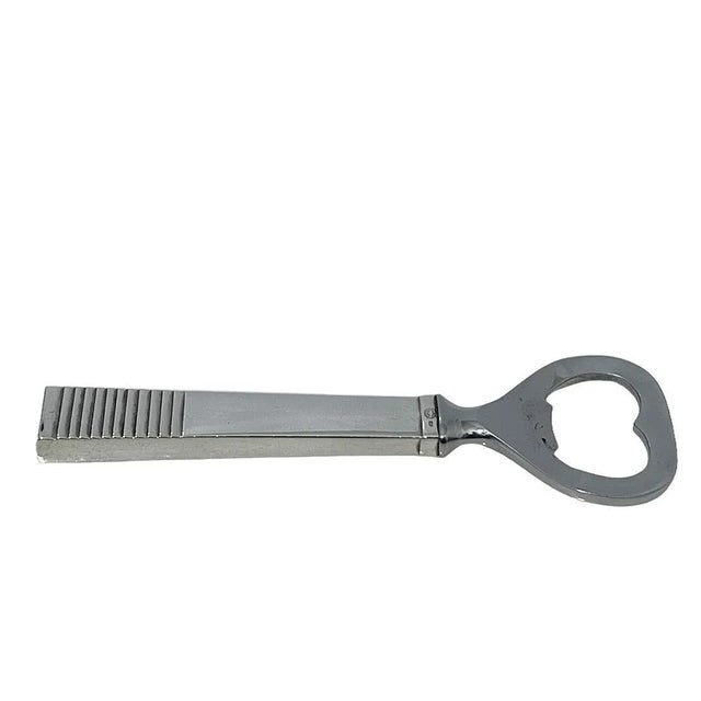 Danish silver bottle opener by Georg Jensen, ca 1950 Georg Jensen bottle opener with sterling silver handle and stainless...