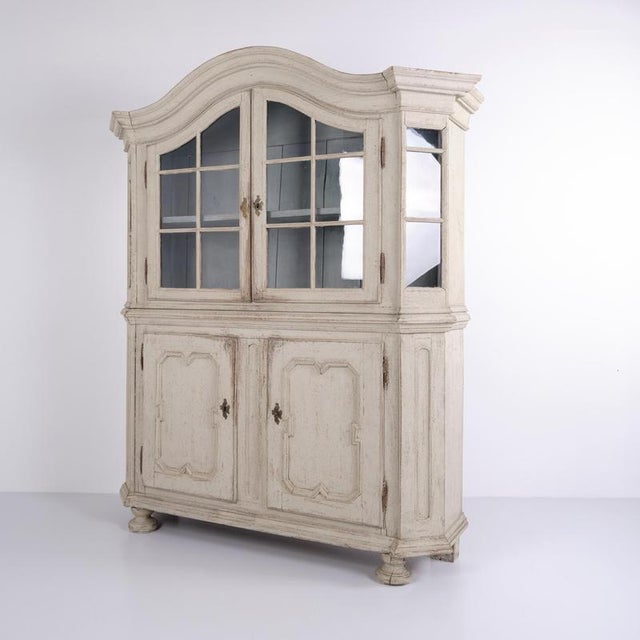 Antique display cabinet of german origin dating from the 1790s. The cabinet is crafted in original painted oak with two...