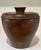 A beautifully crafted Scandinavian Modern teak ice bucket with fitted domed lid, cup-form finial and original opal glass...