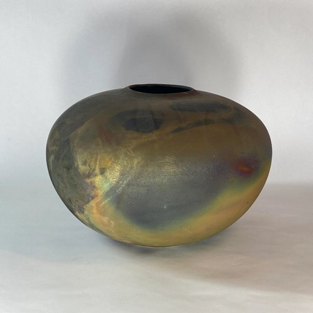 Beautiful Colors For This Large Raku Ceramic Vase by Tony Evans Designs, it has a few marks and a scratch which seems very...