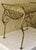 Vintage Hollywood regency style cushioned vanity bench. Measures roughly 21” length x 14” depth x 18” height. Date...