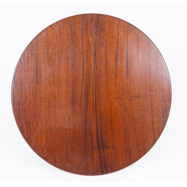 Fine quality Regency Revival mahogany dining table Raised on a beautifully turned central pedestal Graceful swept legs...
