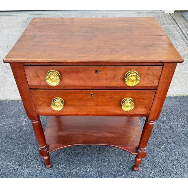 Beautiful antique American 2 drawer Federal period work table. Table was made about 1820-1830. Table is solid cherry with...