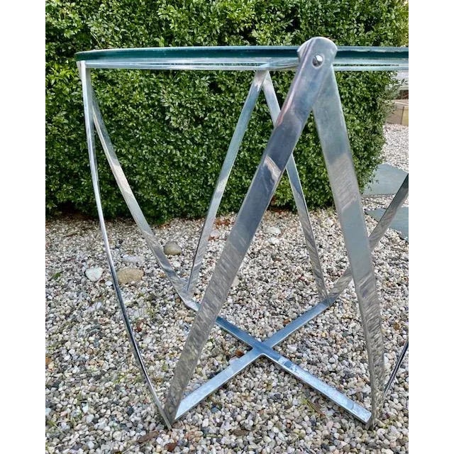 Nice sculptural aluminum and glass vintage side table by John Vesey produced in New York. It is matte chrome steel with a...